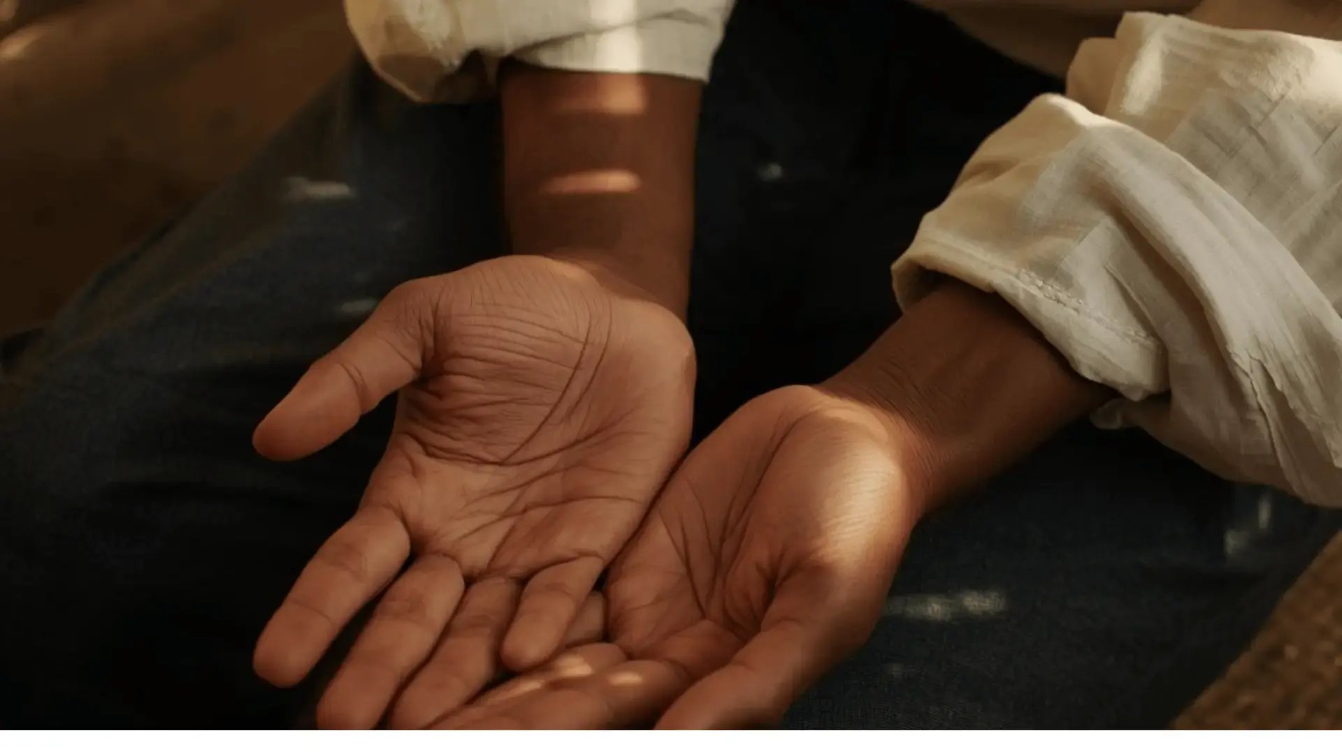 Hands Resting Open in Lap, Somatic Grounding Featured Image Integrating EMDR with Somatic Practices Blog for Trauma Therapist Institute